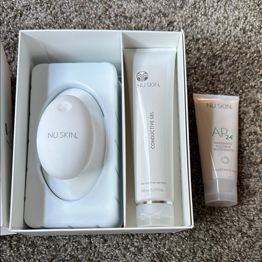 Nu Skin RenuSpa iO device, conductive gel, and whitening toothpaste set
